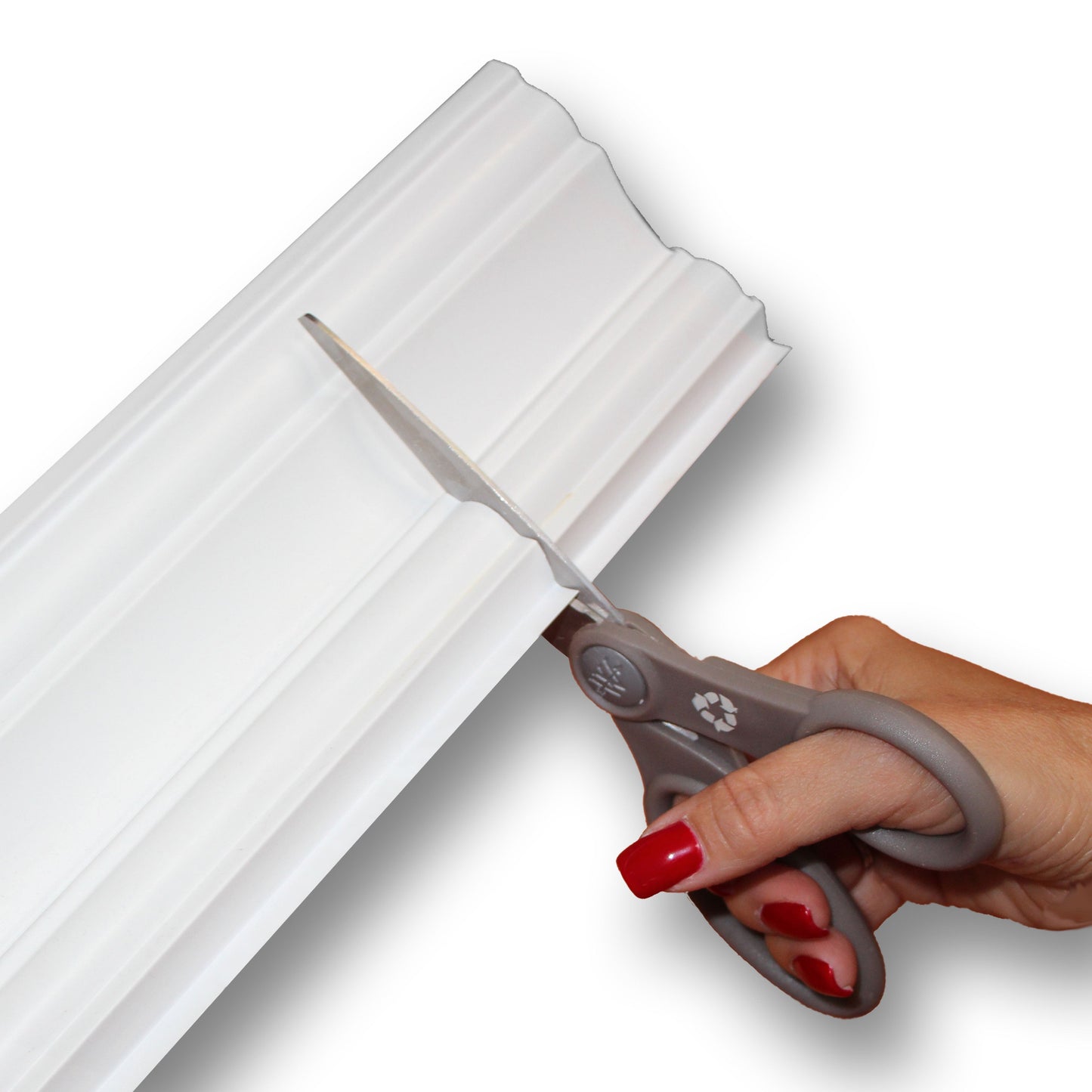 Easy Crown Molding image getting cut with a scissor 